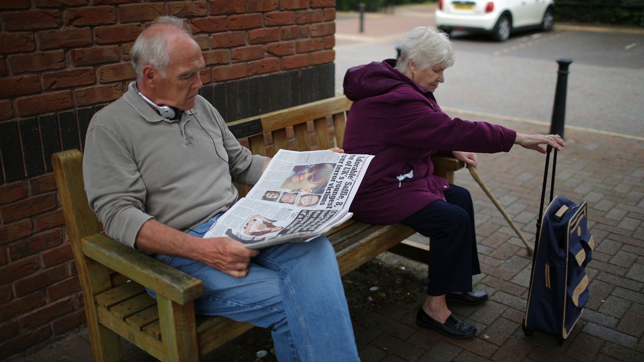 man reading newspaper