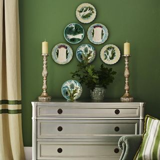 green wall with sideboard