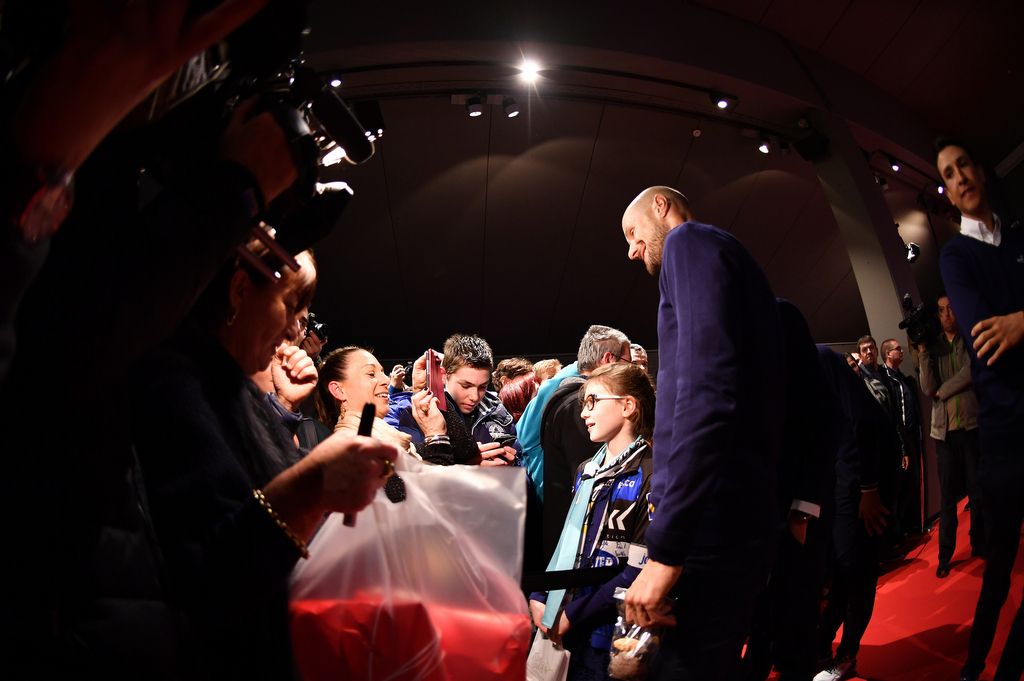 Tom Boonen poses for a photo with a young fan