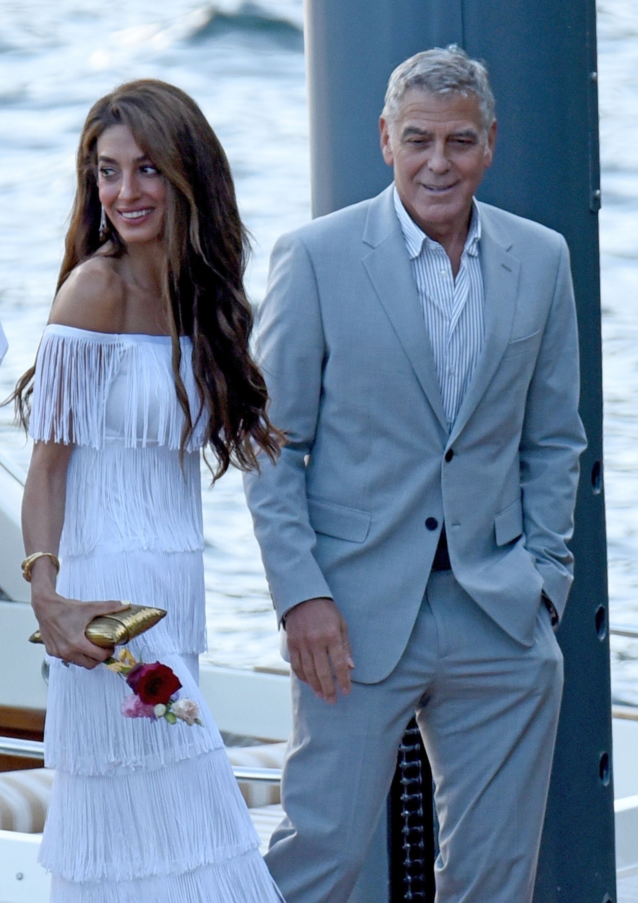 Amal Clooney arrived in Lake Como wearing a fringed white dress