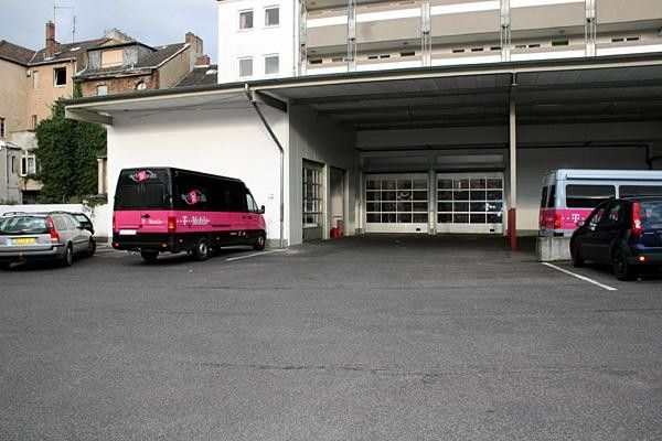 The T-Mobile vehicles inspect their new parking places.