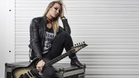 Portrait of American musician Nita Strauss, photographed backstage during the UK Guitar Show at the Olympia in London, on September 30, 2018. Strauss is best known for performing as a guitarist with hard rock musician Alice Cooper. 