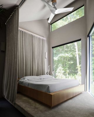 a bedroom surrounded by curtains