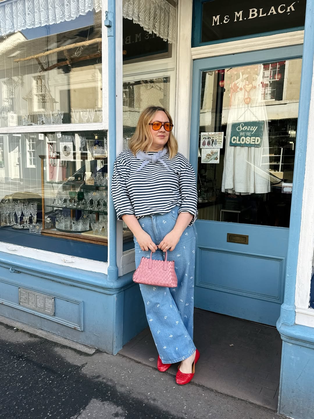 Influencer Charlotte Jacklin wearing embroidered jeans and breton stripe top.