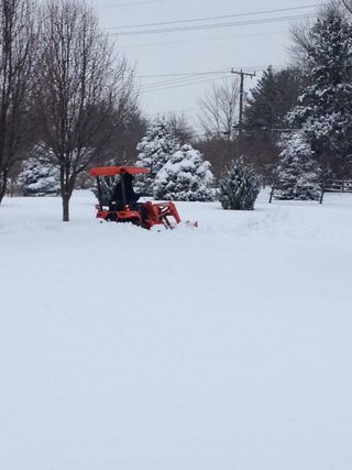 Tractor plowing snow