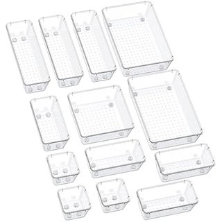 A set of 13 clear plastic drawer organizers in varying rectangular sizes will help keep things in functional categories.