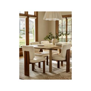 round wood dining table with wood chair and sherpa seating