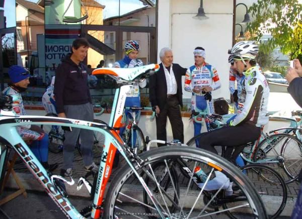 Savio puts his arm around one rider after informing him he'll be riding six hours today