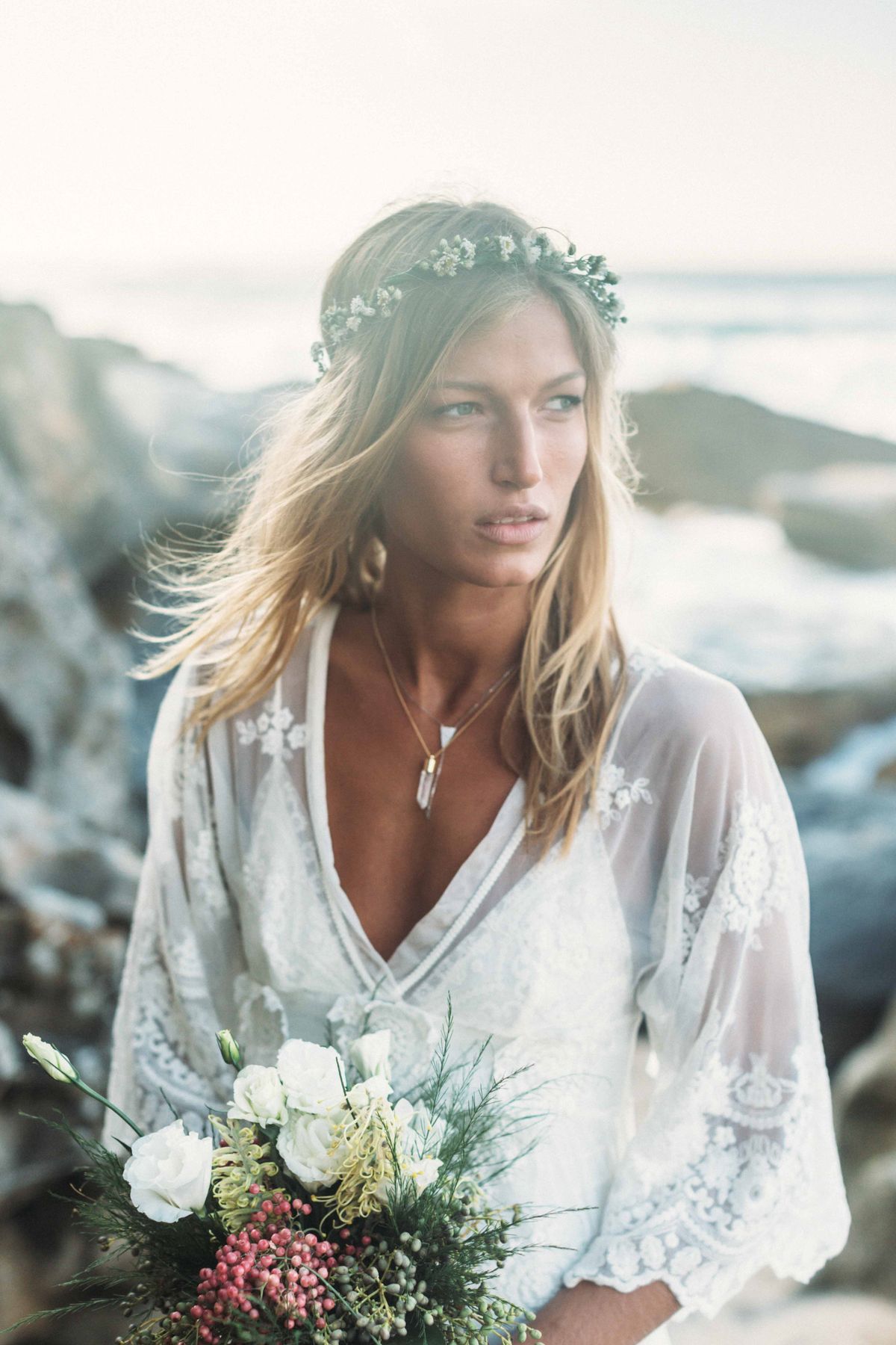 A young bride in a lacy white dress