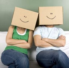 a couple with boxes on head