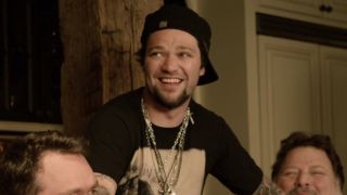 Bam Margera smiles standing between two co-stars in Jackass 3D.