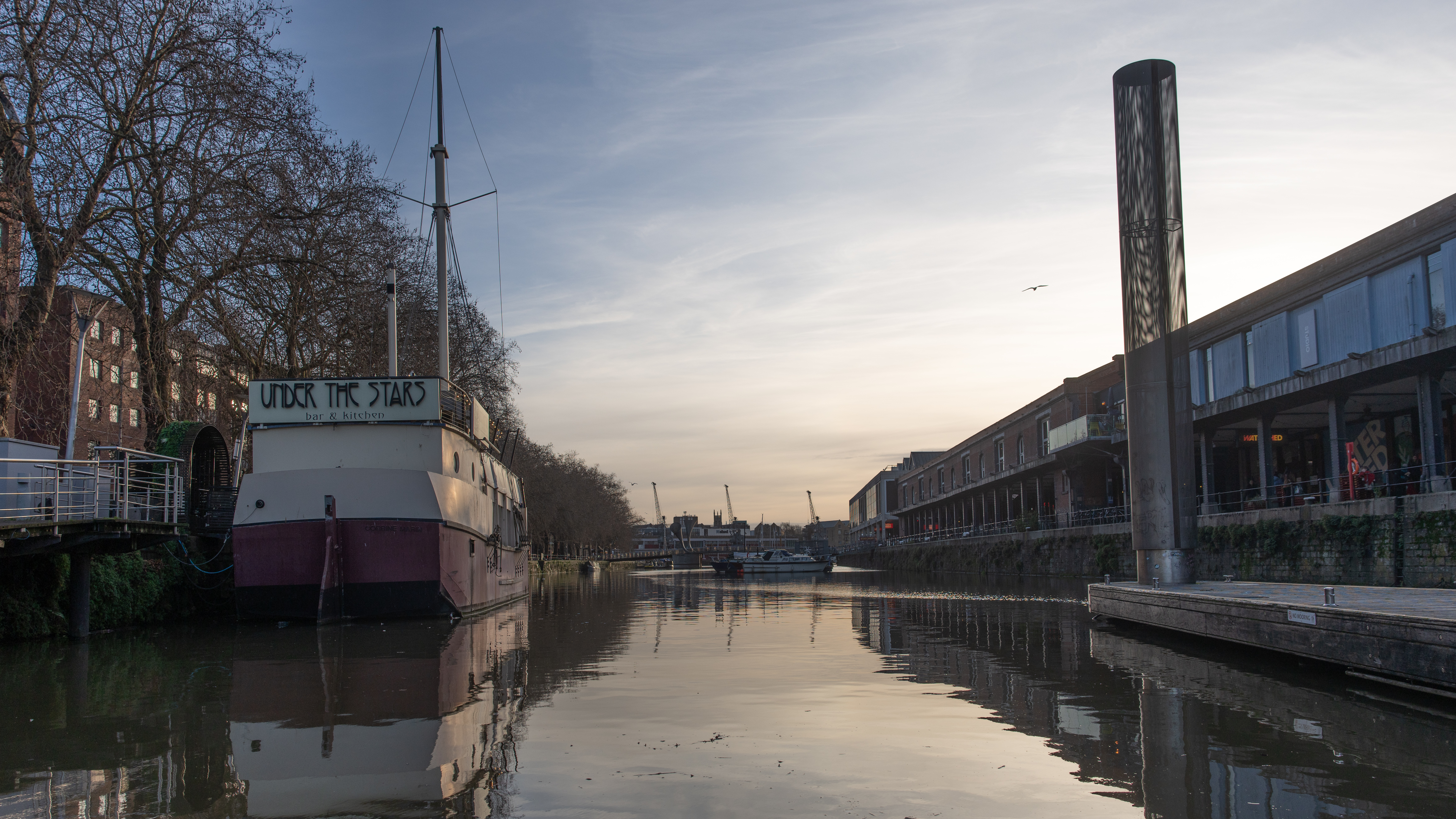 A wide-angle shot of Bristol Harbour taken at sunset
