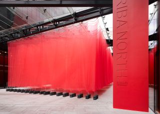 An image of a red mesh structure and a RIBA North sign