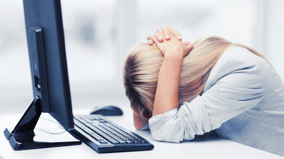 woman stressed at computer