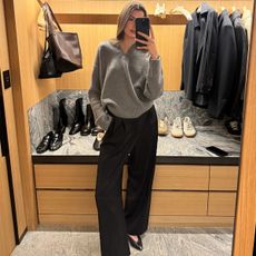 Anna Porte wearing a v-neck sweater.