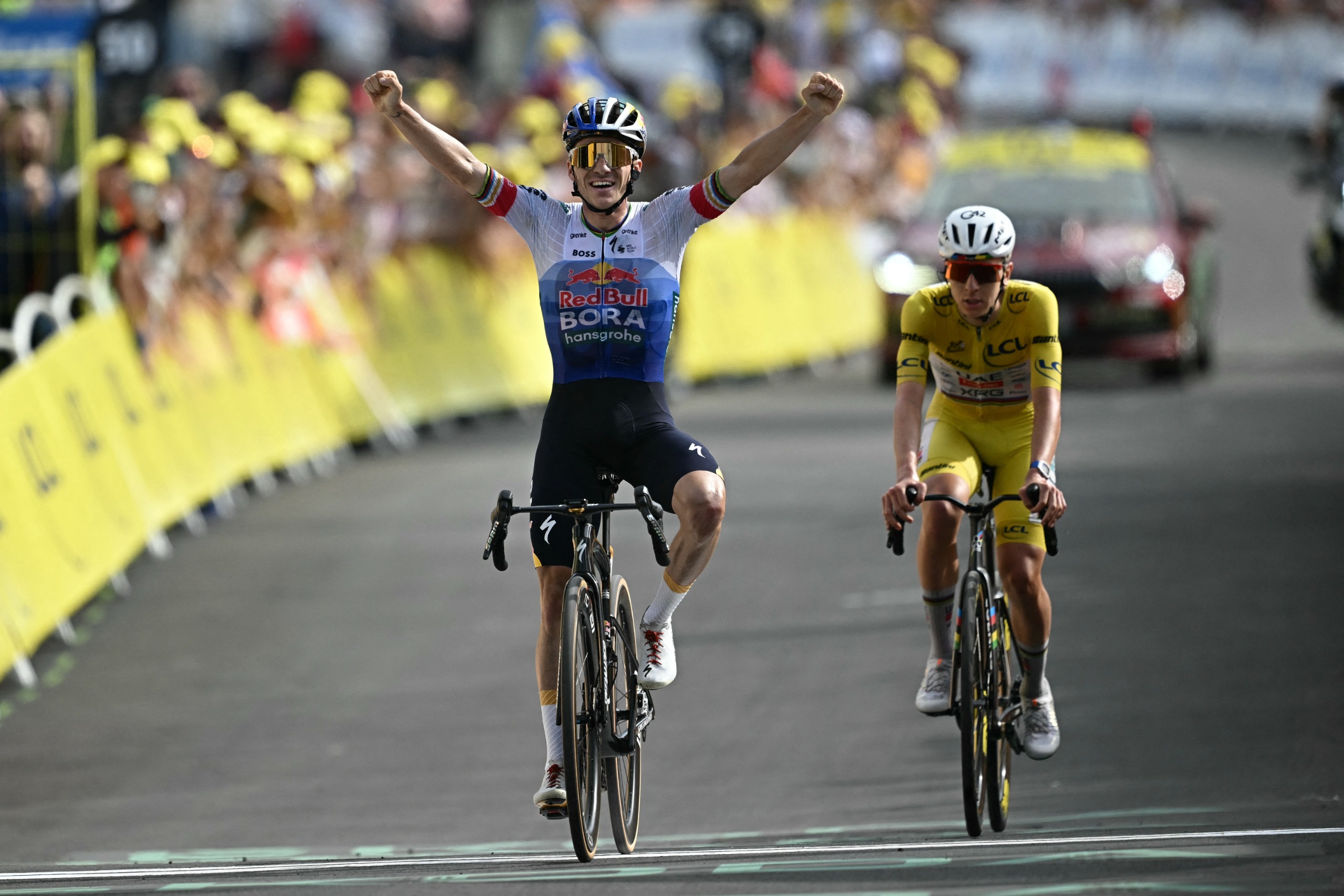 Red Bull - BORA - hansgrohe team's Belgian rider Remco Evenepoel cycles to the finish line to win the 15th stage ahead of UAE Team Emirates - XRG's Slovenian rider Tadej Pogacar during the 113th edition of the Tour de France cycling race, 183,9 km between Champagnole and Plateau de Solaison in the Jura mountains, on July 19, 2026. (Photo by Loic VENANCE / AFP via Getty Images)