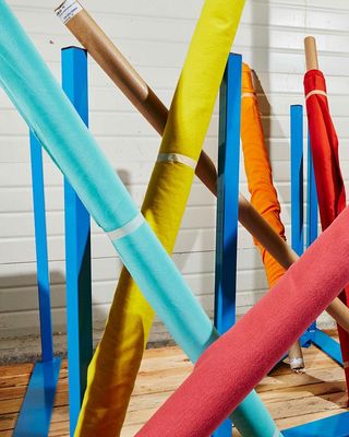 Fabric rolls at Nona Source storage facility in France, featured in one of Wallpaper's top 10 fashion posts of 2021
