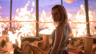 Brec Bassinger standing amidst flames in Final Destination Bloodlines