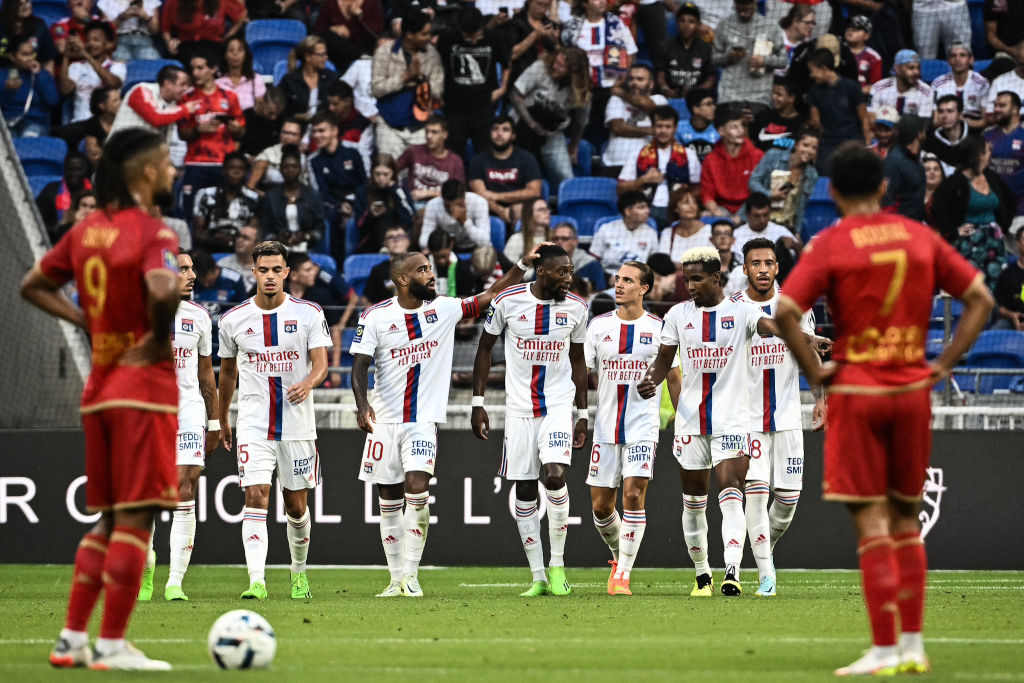 Lyons Cameroonian forward Karl Toko Ekambi (C) celebrates with his teammates after scoring a goal during the French L1 football match between Olympique Lyonnais (OL) and SCO Angers at The Groupage Stadium in Decines-Charpieu, central-eastern France on September 3, 2022.