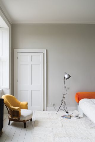 A contemporary bedroom painted in Skimming Stone by Farrow & Ball