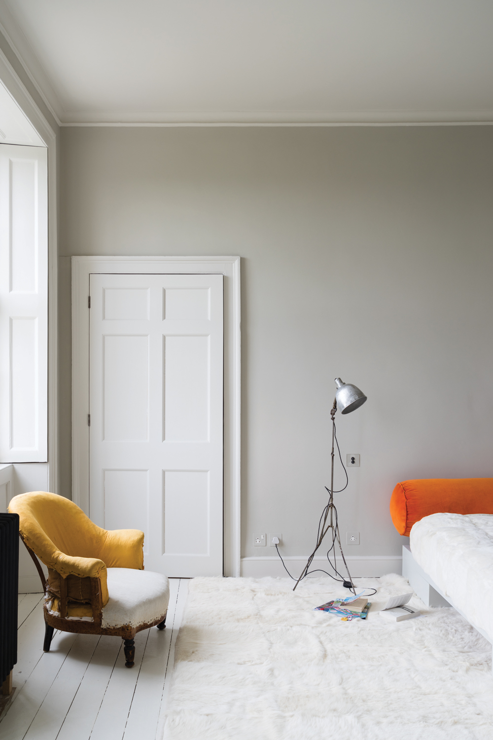 A contemporary bedroom painted in Skimming Stone by Farrow & Ball