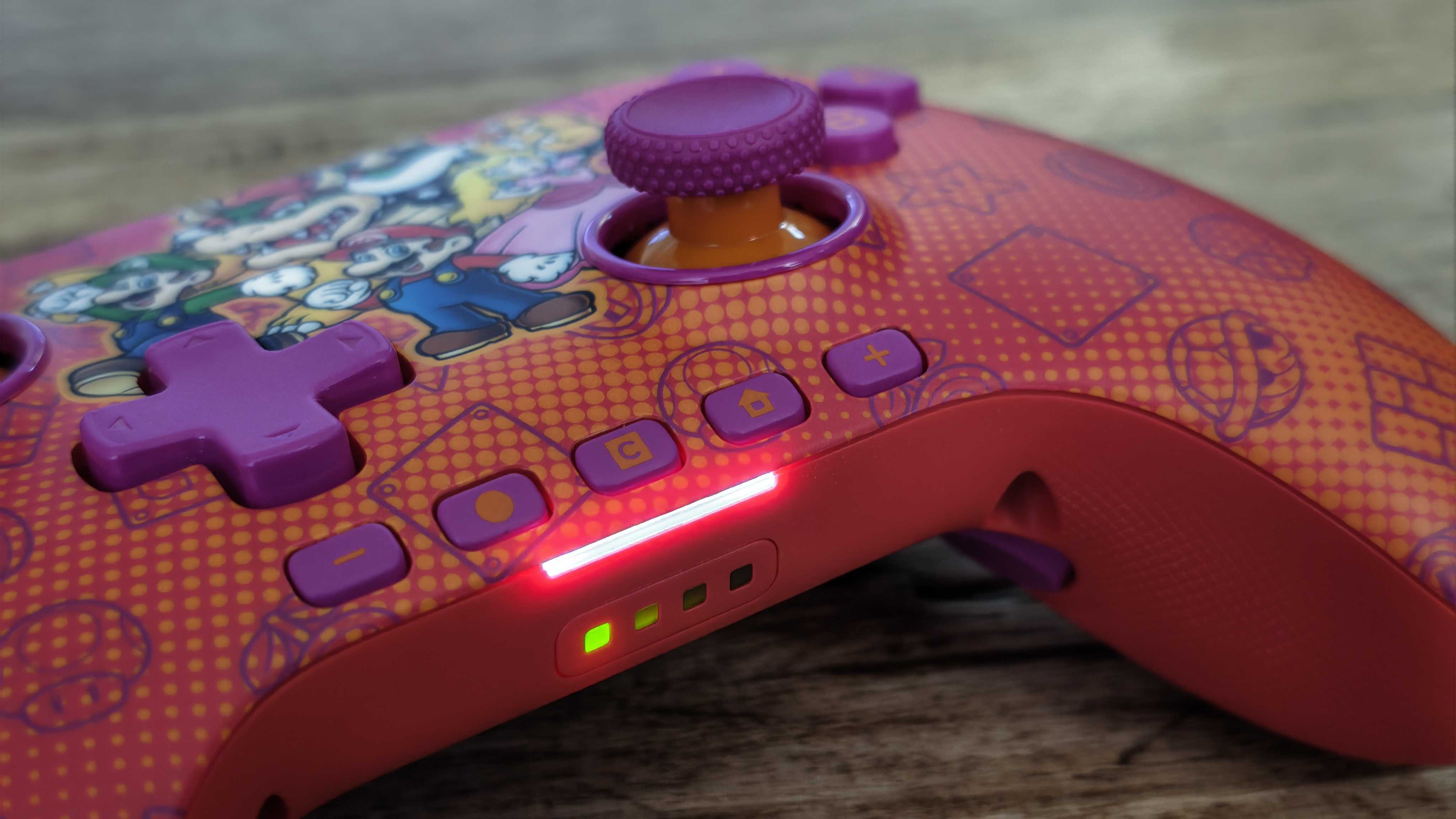 The PowerA Advantage Wireless Controller for Nintendo Switch 2 on a wooden table surface.