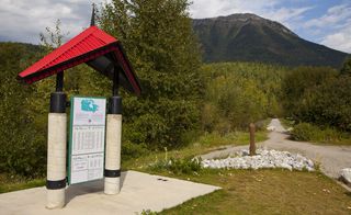 The Trans Canada Trail sign with with path in the background