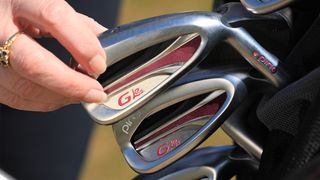 The classic Ping G Le 2 irons resting inside a golf bag