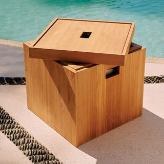 A poolside storage box with lid