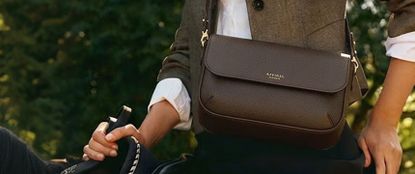 Woman wearing Aspinal bag on a horse
