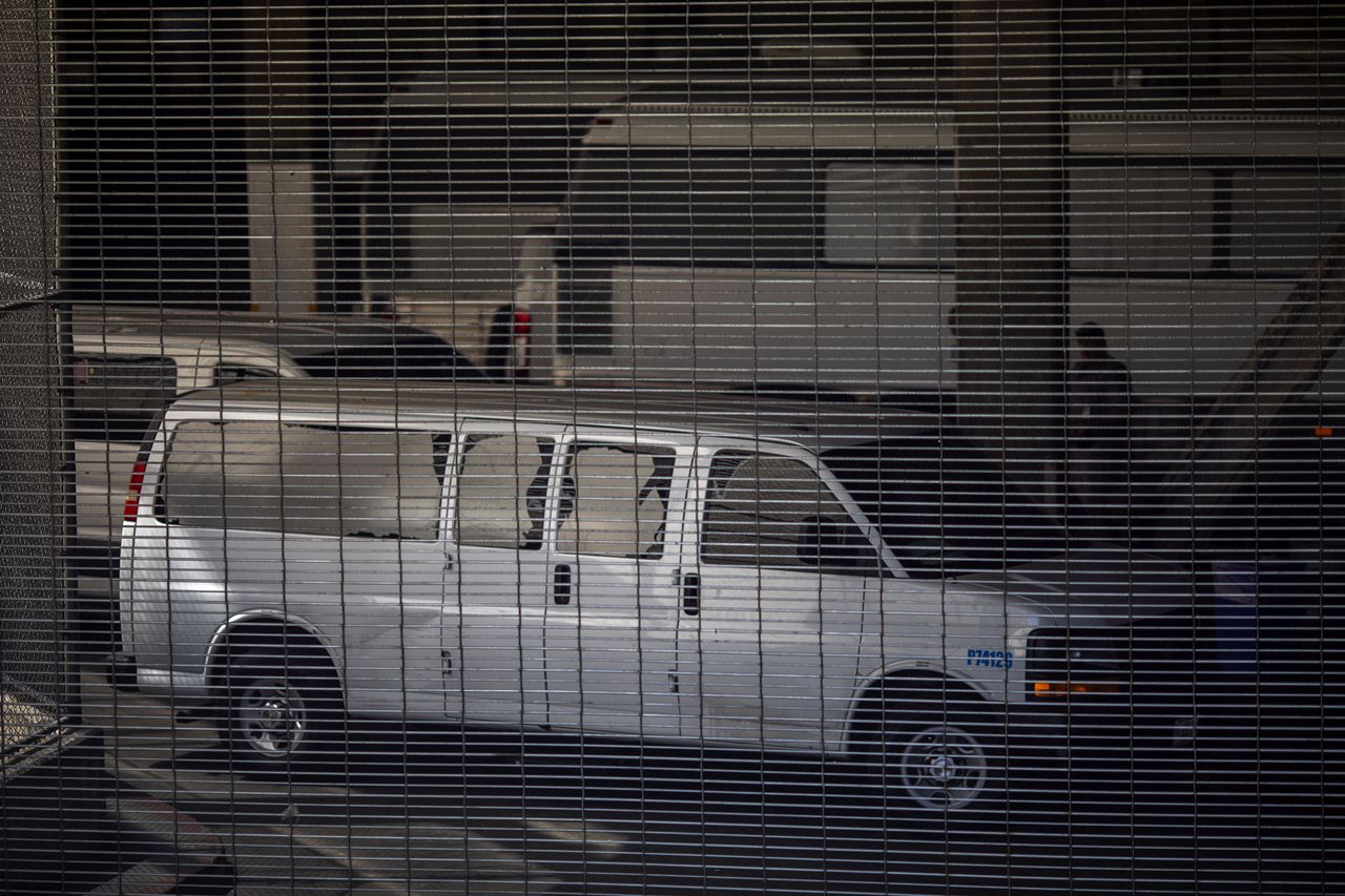 Vehicles are seen in an intake area under the Metropolitan Detention Center in L.A.