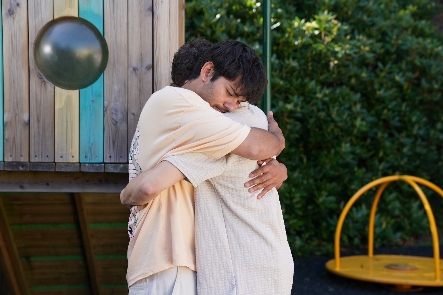 Dillon Ray and Lucas Hay embracing.