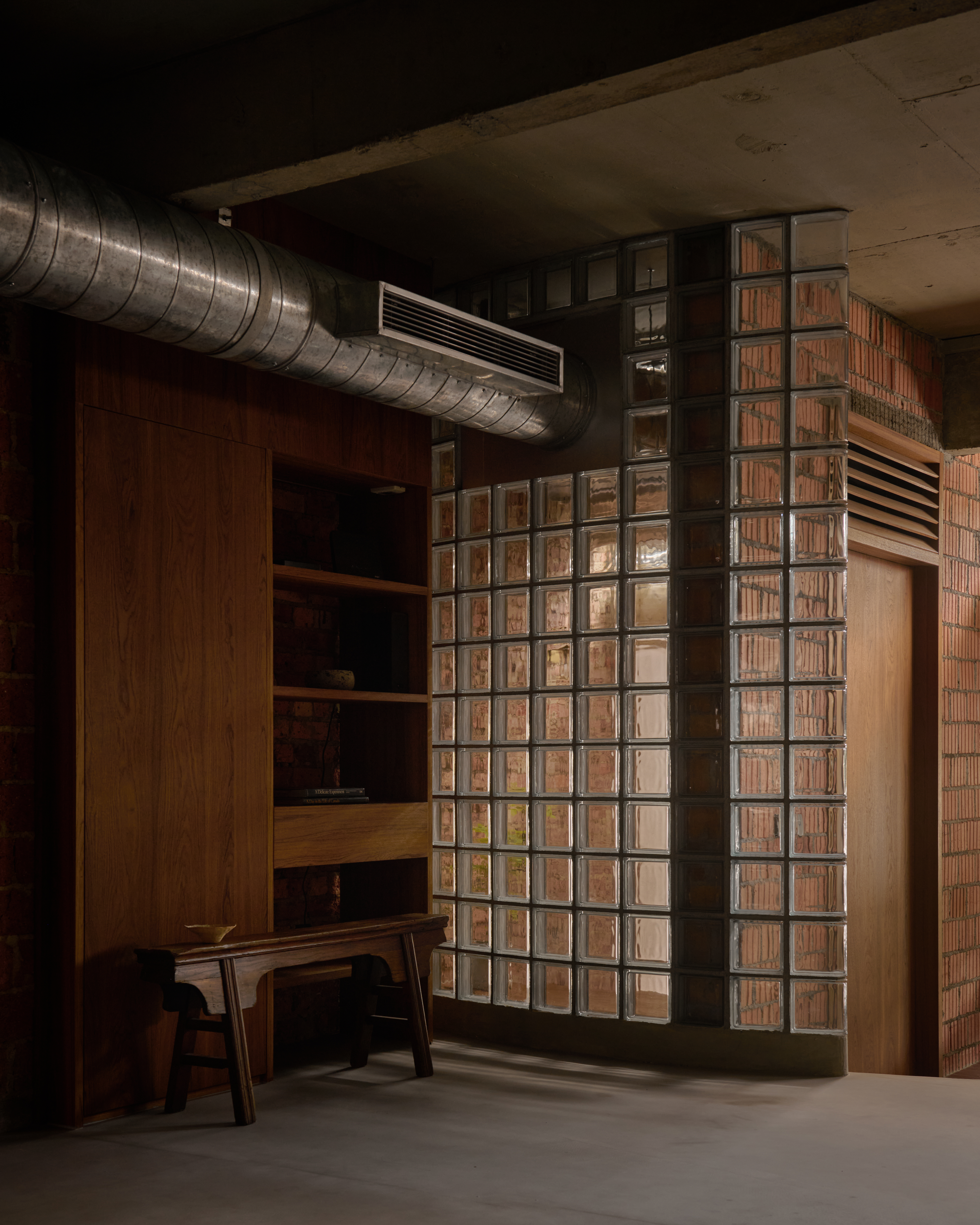 'My last home' by L Architects, a raw interior space of exposed brown brick and wood detailing