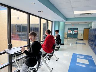 Students in the Brigantine Public School District use the bicycle desks in the hallway.