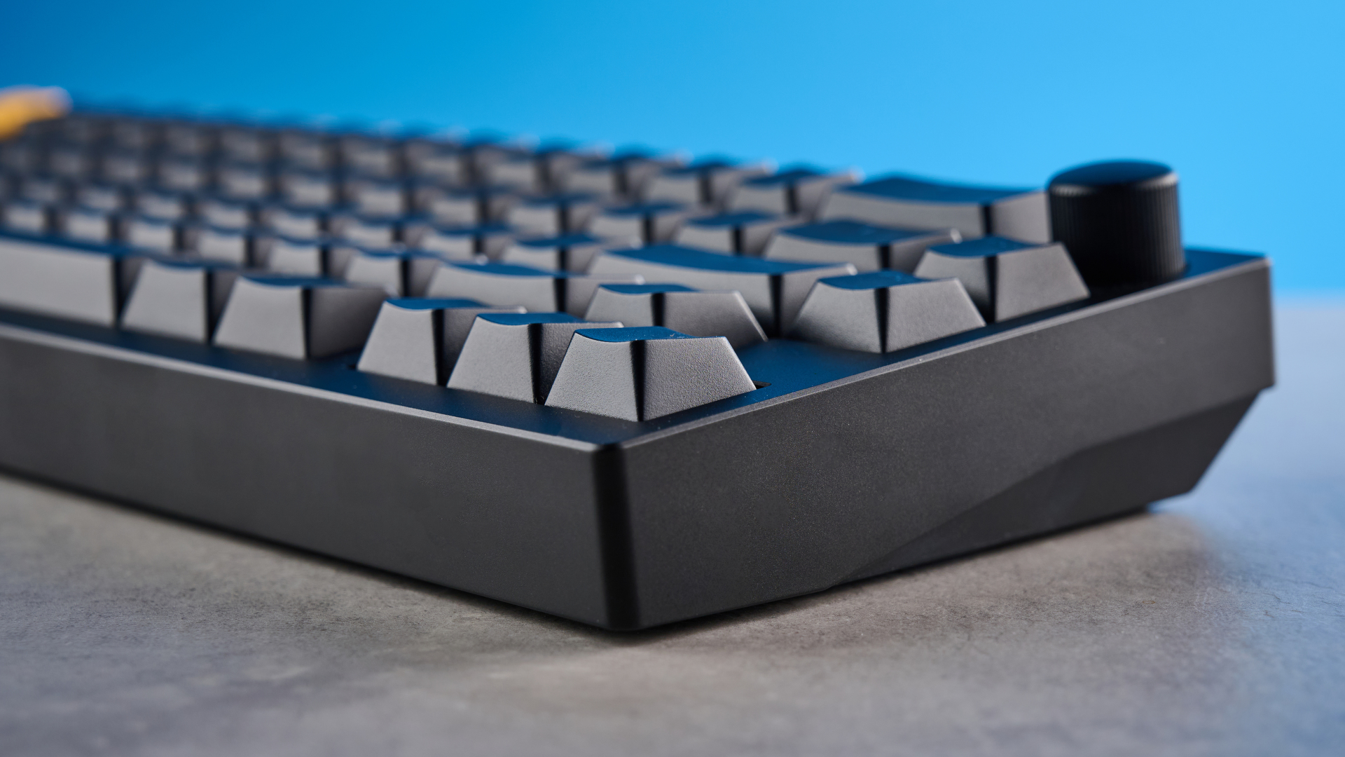 Lemokey P2 HE on a stone surface with a blue background