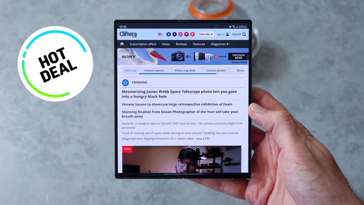 Samsung Galaxy Z Fold 6 held in a hand next to a sticker reading &#039;hot deal&#039;