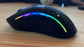 Side of Glorious Model D 2 gaming mouse showing side buttons and RGB strip
