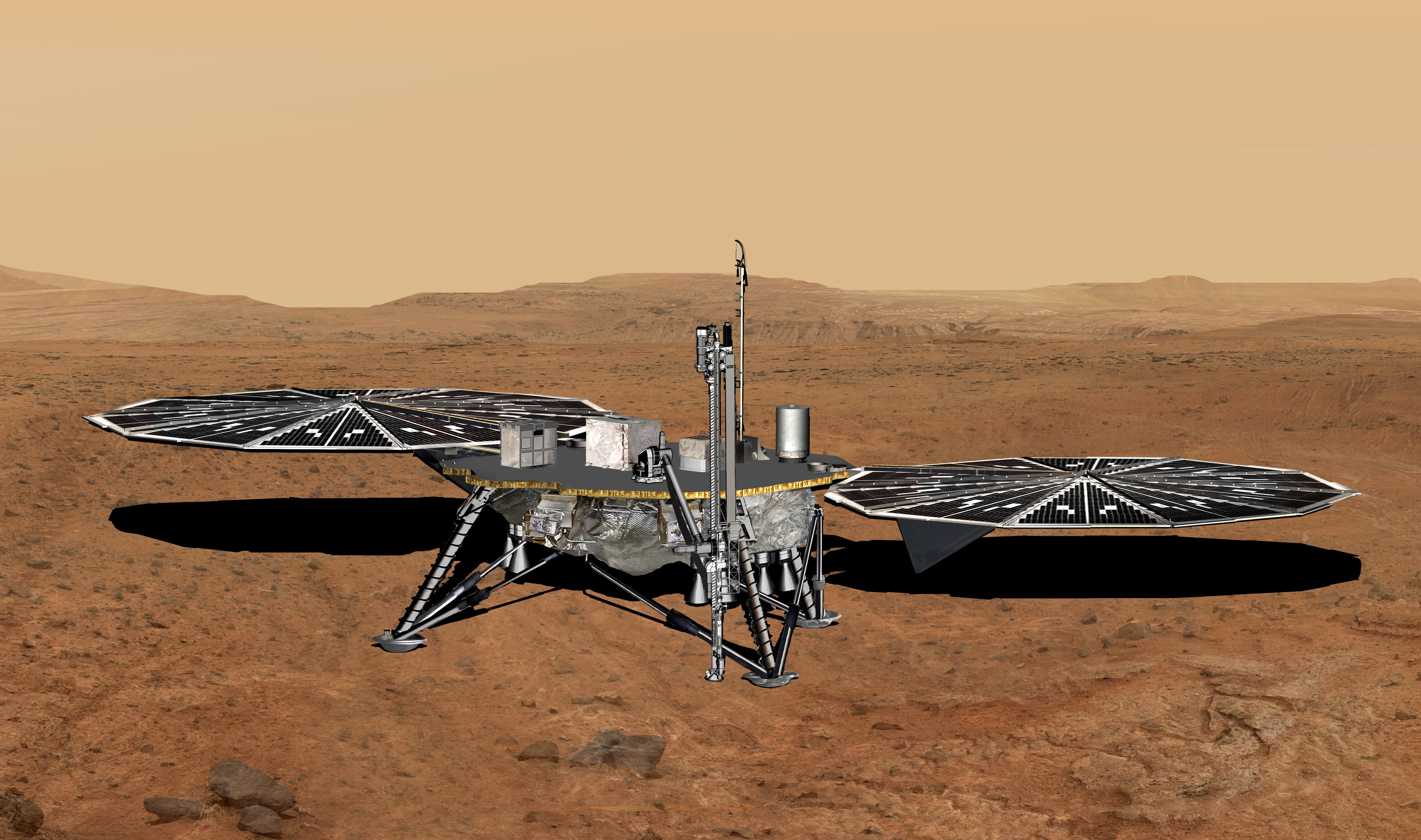 A squat lander with four legs and two large solar panels on the surface of a reddish-orange desert planet