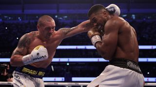 Oleksandr Usyk of Ukraine fights Anthony Joshua of Great Britain during the Heavyweight Title Fight between Anthony Joshua and Oleksandr Usyk at Tottenham Hotspur Stadium on September 25, 2021