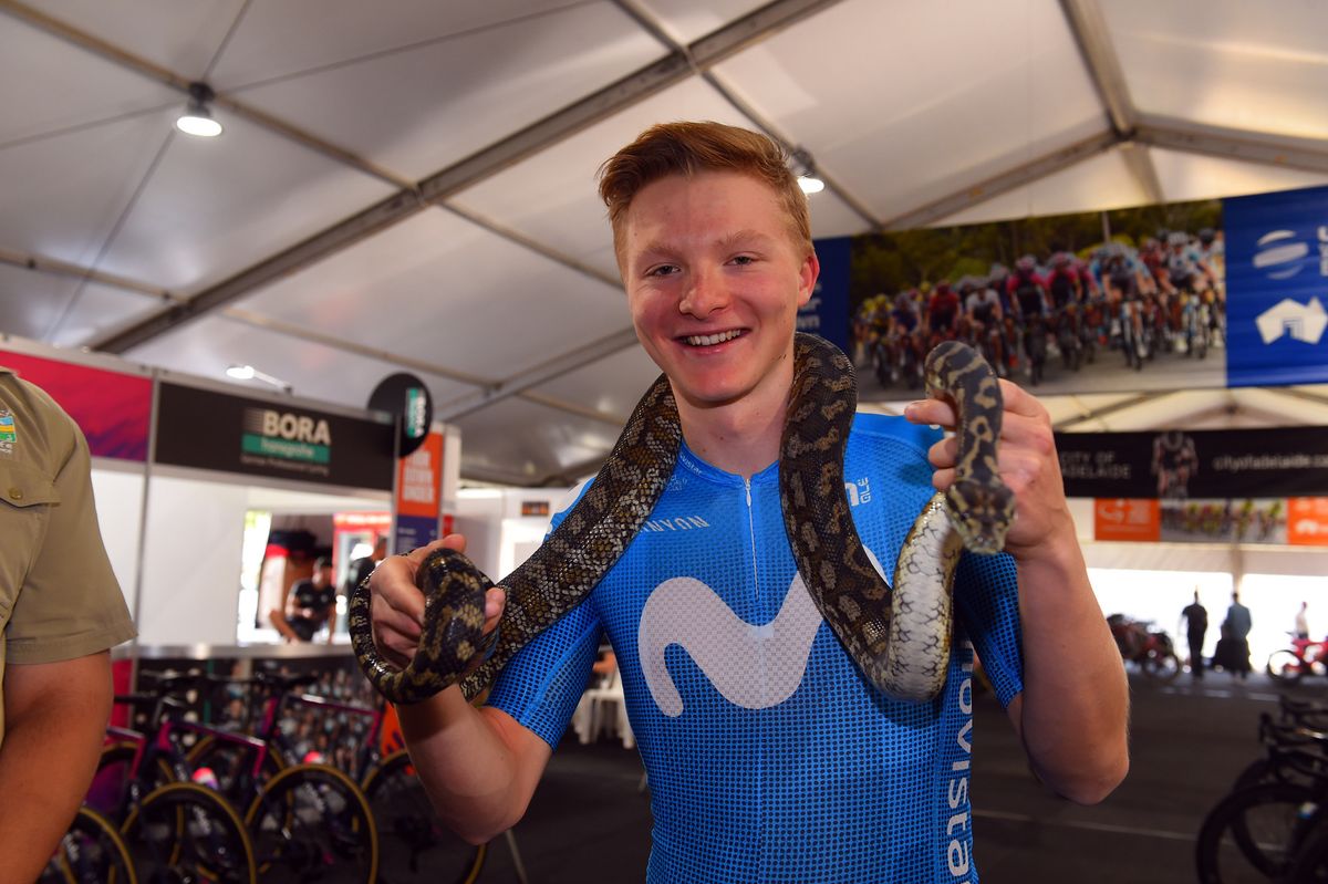 Juri Hollman holds a snake