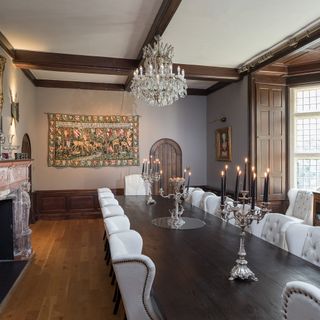 dining room with wooden dining table and candles