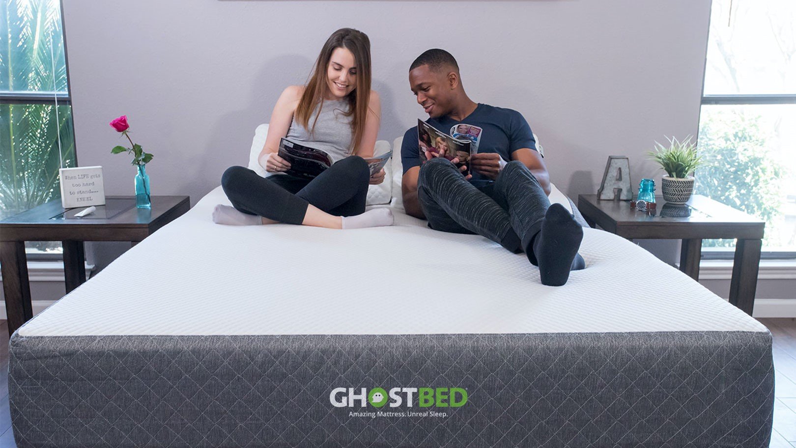 GhostBed discount codes, sales and deals: A man and a woman relax on the GhostBed Classic together