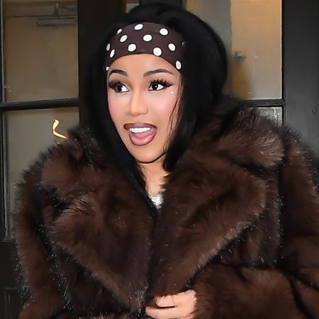Cardi B was seen in New York City wearing a polka-dot take on the stirrup leggings trend, a matching dress, and headband