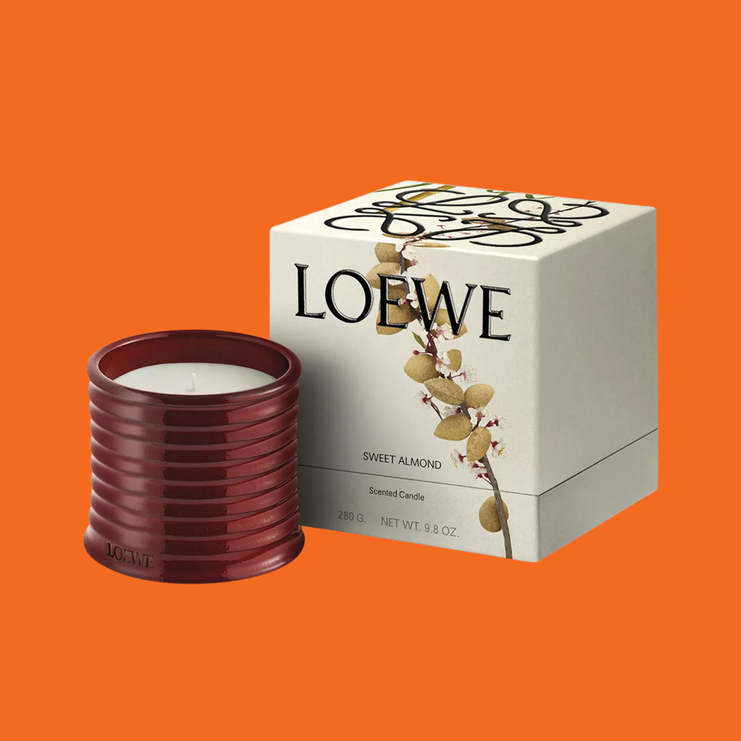 A brown candle by a white box