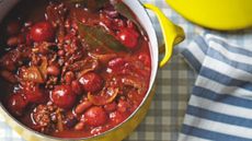 Chilli Con Carne in a yellow pan on a blue and white gingham table cloth