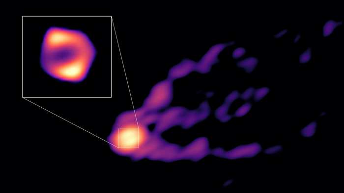 The black hole M87* pictured with a gigantic jet of material streaming from it.