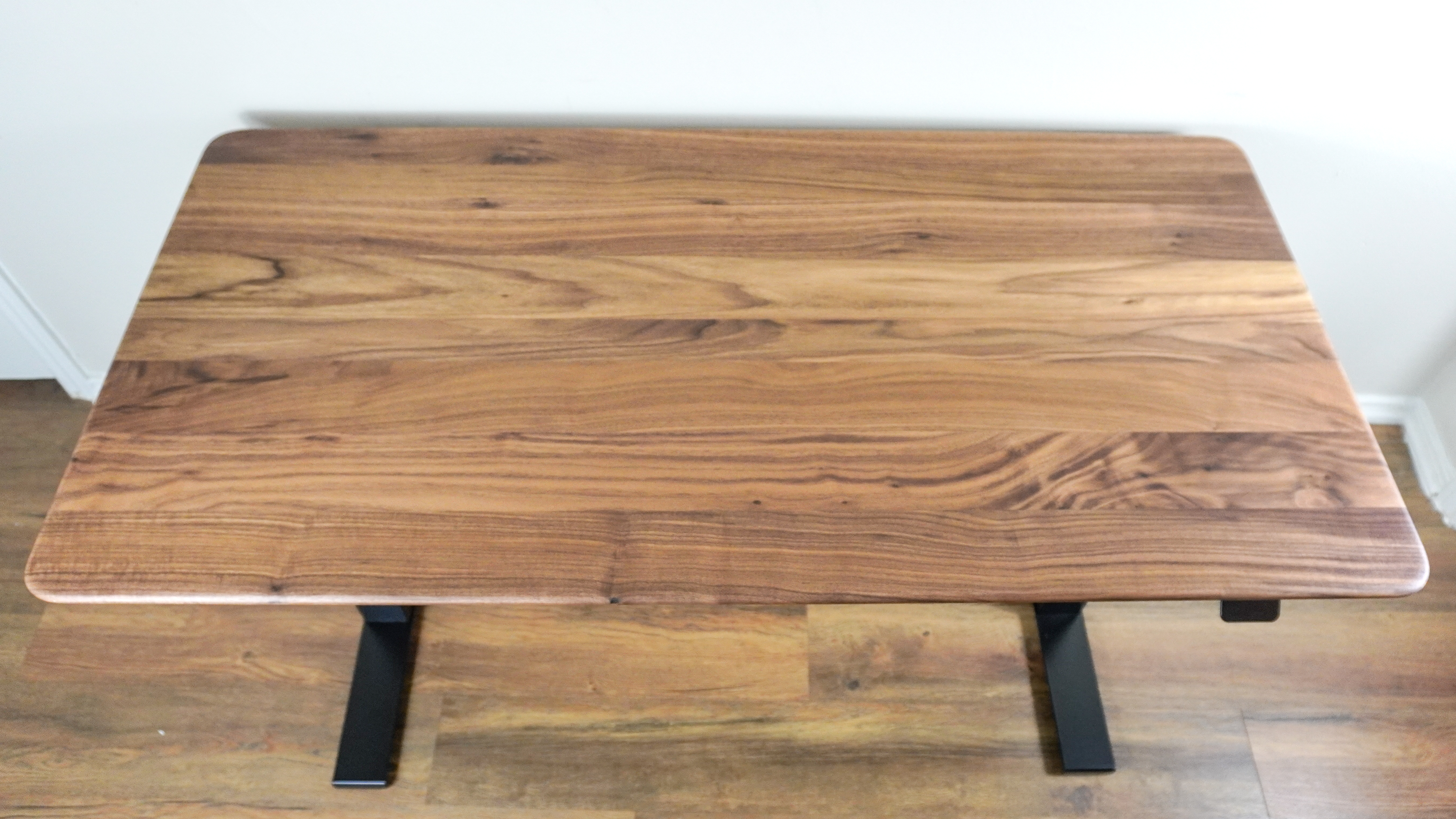 An overhead view of the Oakywood Standing Desk Pro with a walnut desktop
