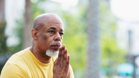 Senior man with a serious expression thinking