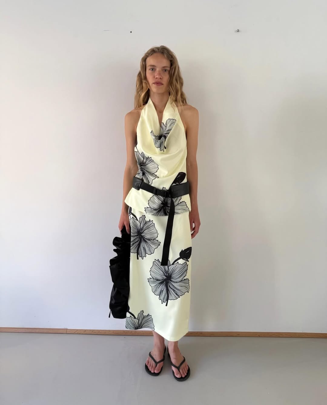 an Opera Sport model wearing a floral two-piece skirt set