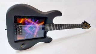 A shot of an iPad embedded into a guitar on a white background